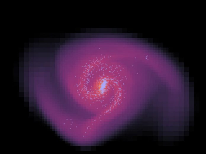 1,5 bilhão de anos após o início da simulação. Quanto mais clara a cor, maior a densidade do gás. Os pontos azuis claros mostram estrelas jovens. Crédito: AG Kroupa / Uni Bonn