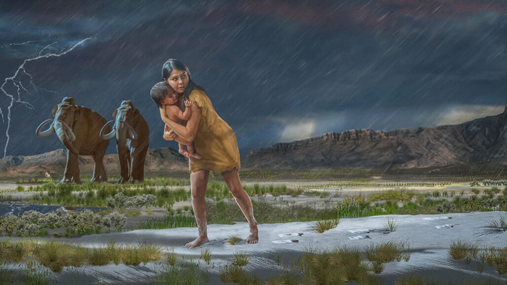 O maior conjunto de pegadas humanas, datado da Idade do Gelo, foi possivelmente feito por uma jovem carregando uma criança. O rastro sugere que os dois encontraram um mamute (dois mostrados na ilustração) e uma preguiça-gigante – Foto: Reprodução/Karen Carr
