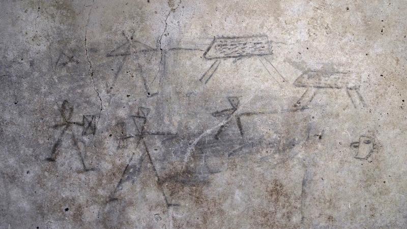 desenhos de uma criança em Pompeia